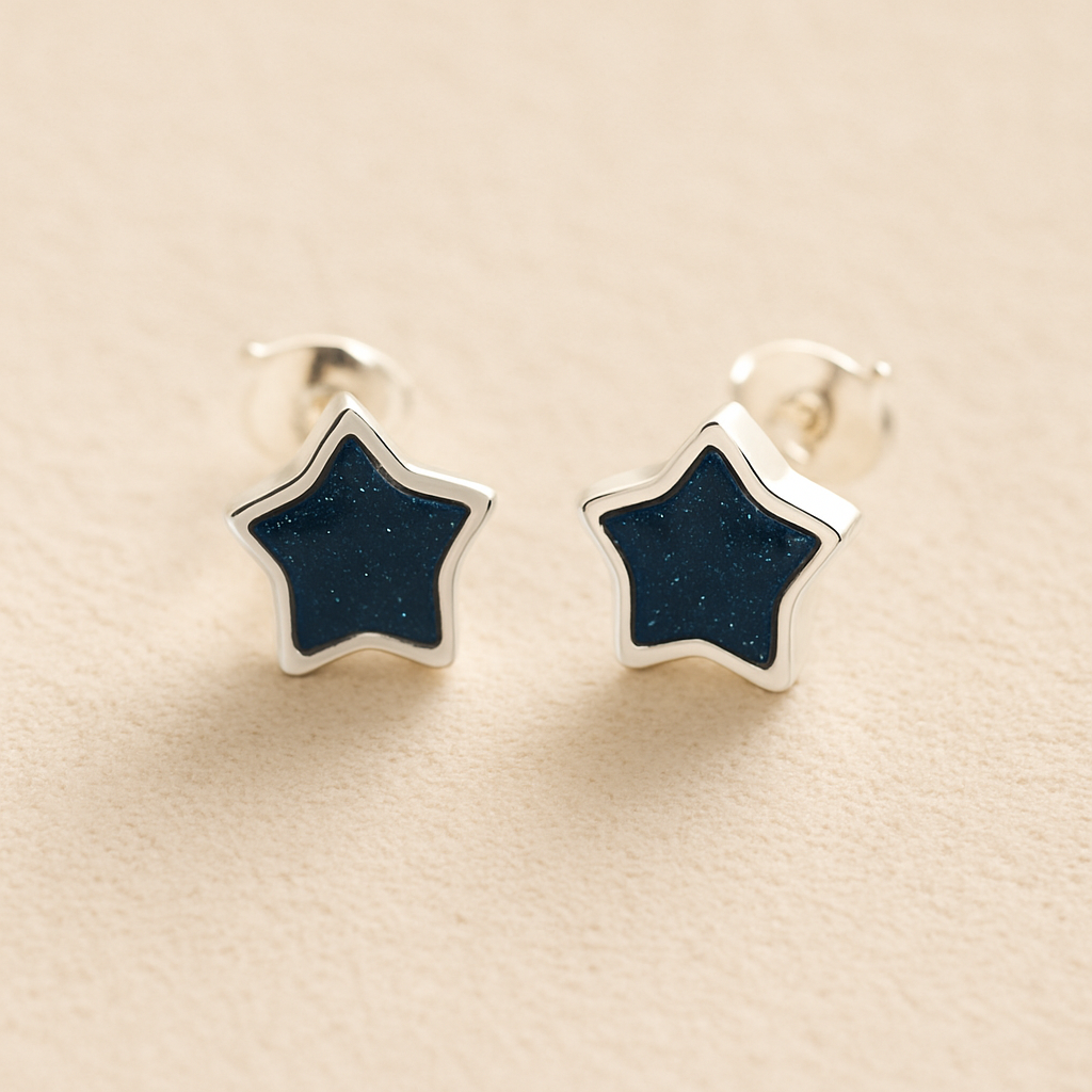 Silver Memorial Star Ashes Earrings with navy resin on a beige background