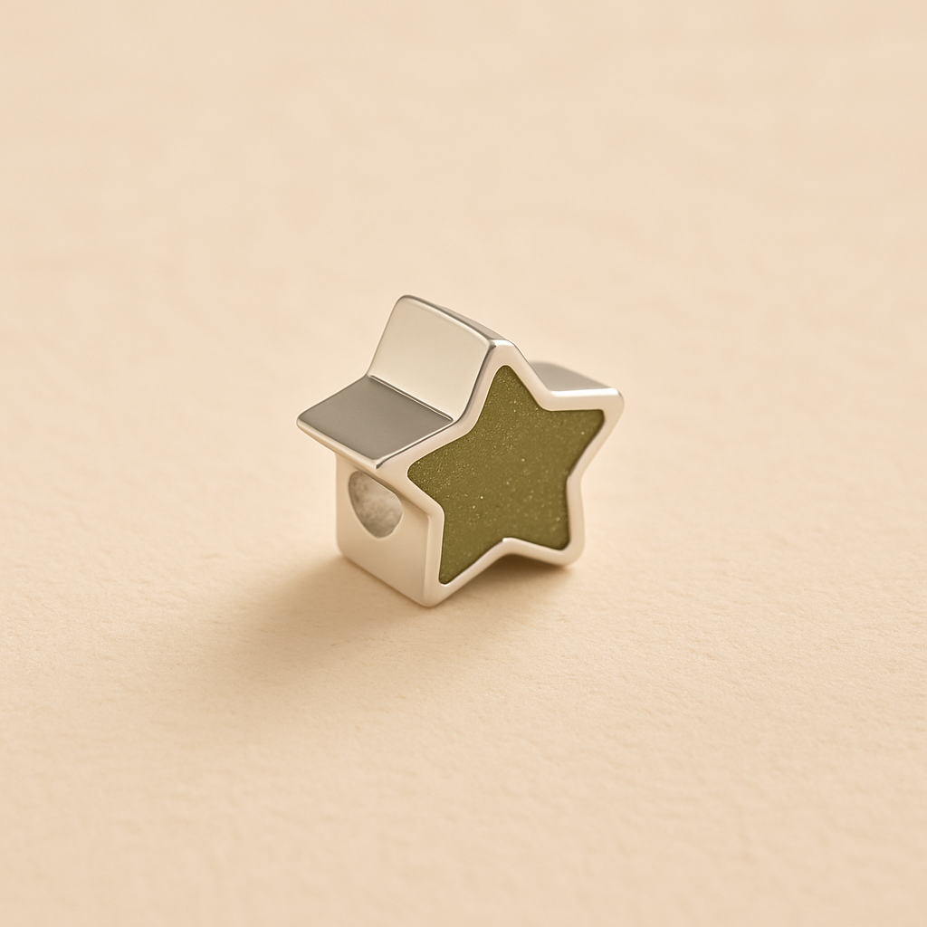 Silver star ashes Charm Bead with a sage resin on a beige background