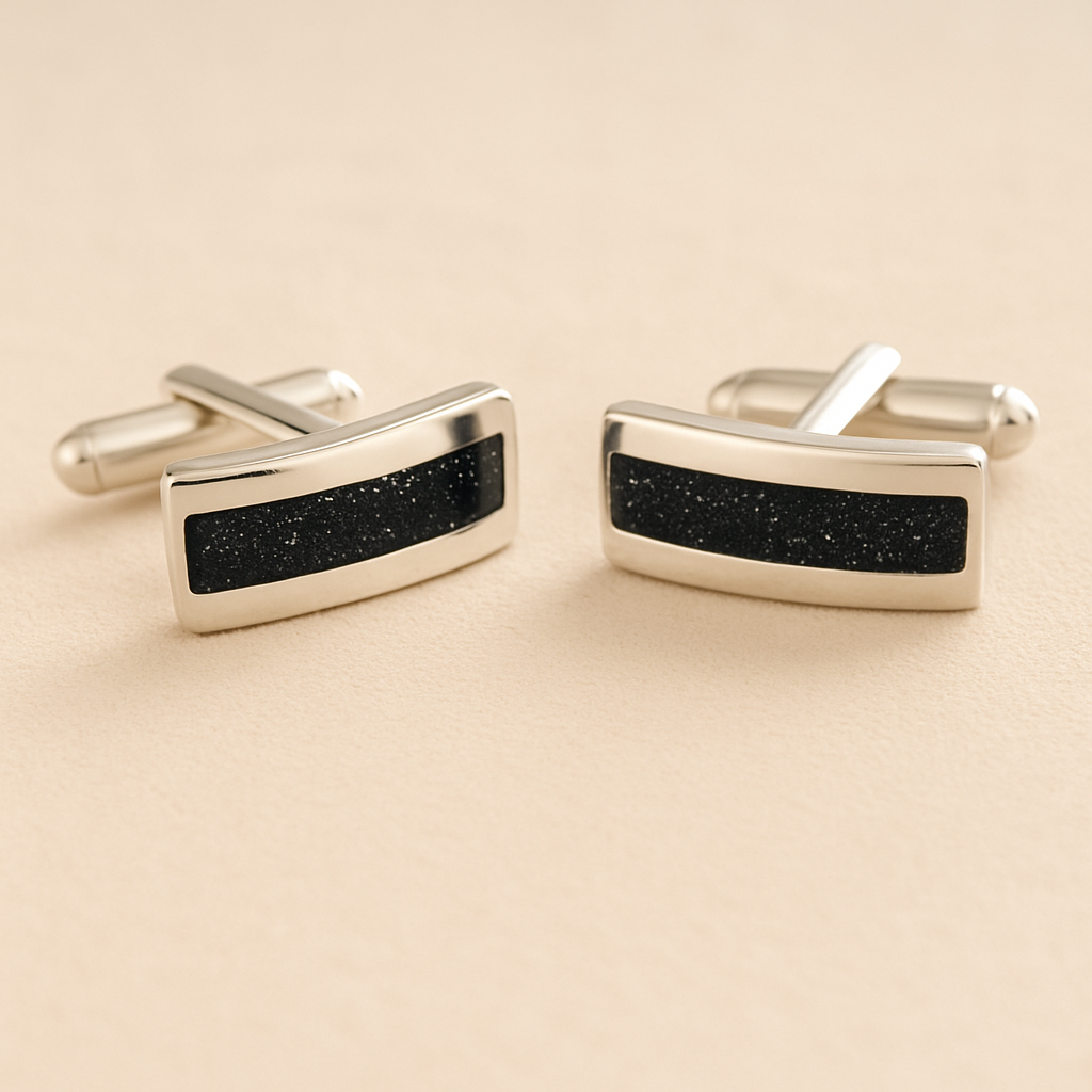 Silver Curved Ashes cufflinks with black resin inlay with cremation ashes or fur on a beige background