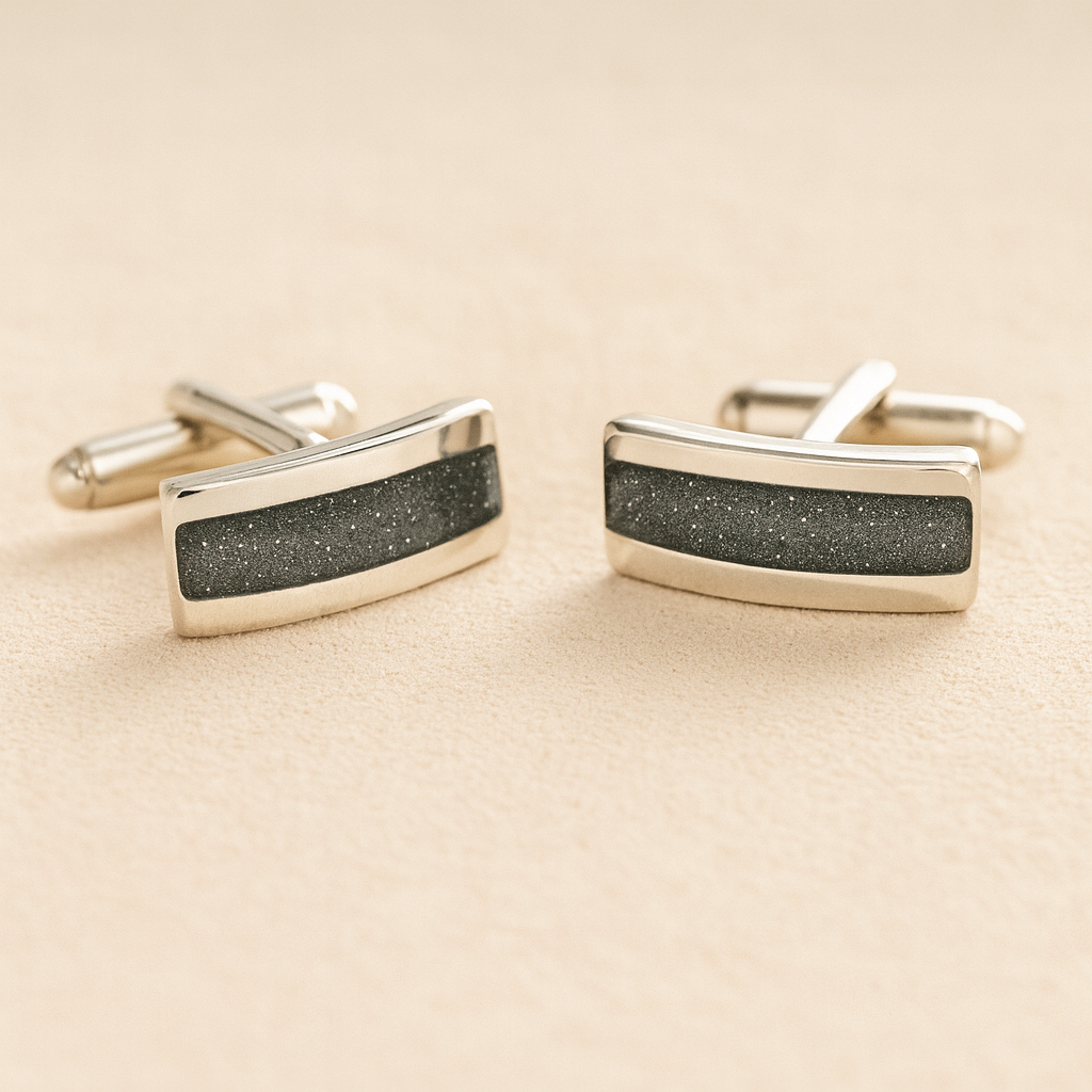 Silver Curved Memorial cufflinks with grey resin inlay with cremation ashes or fur on a beige background