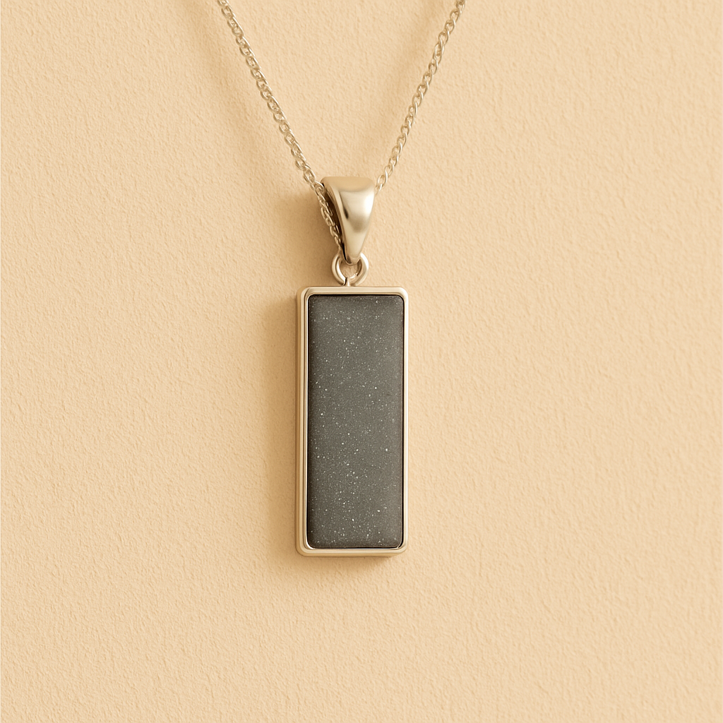 Men’s Cremation Ashes Rectangle Necklace with grey resin on a beige background