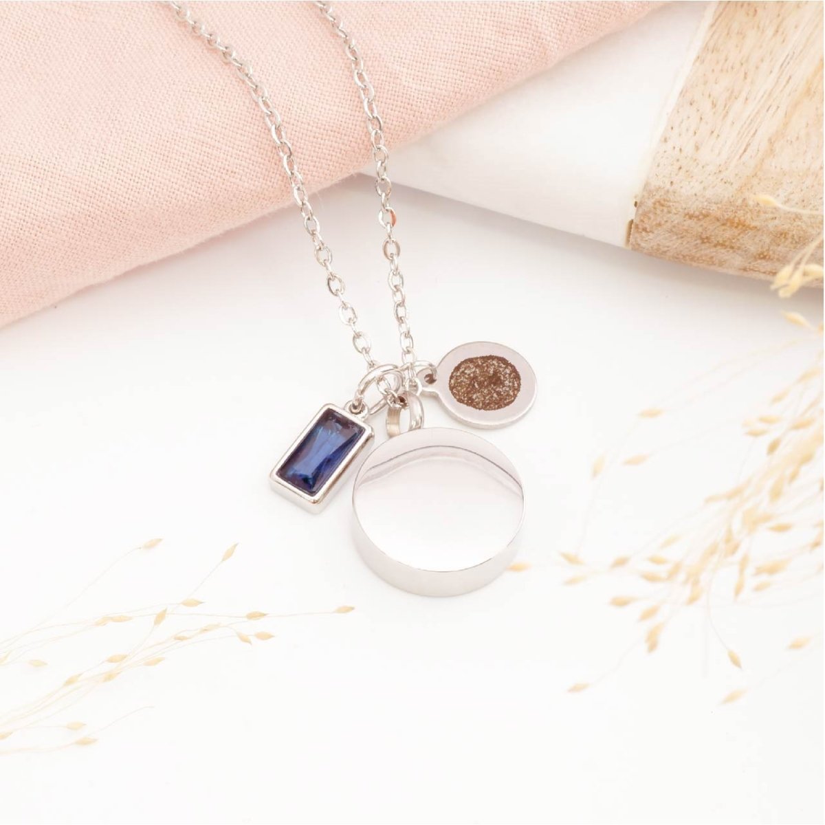 Fingerprint necklace with self fill urn pendant and birthstone charm on a light background. Memorial Jewellery for him