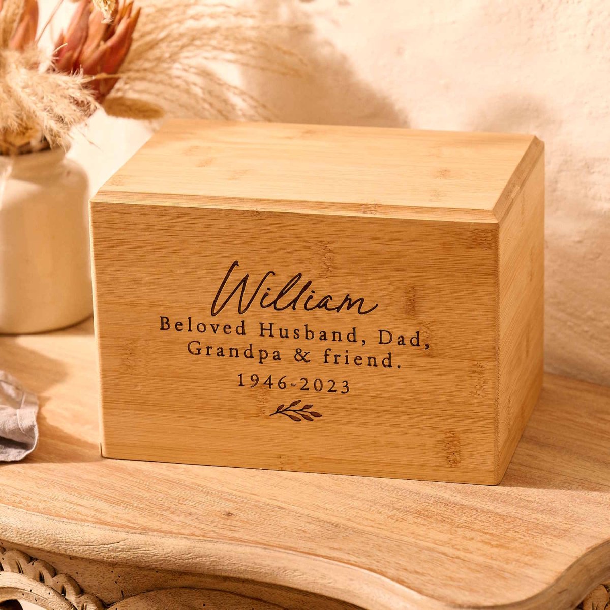 Handcrafted bamboo urn with custom floral design for women – sustainable ashes keepsake