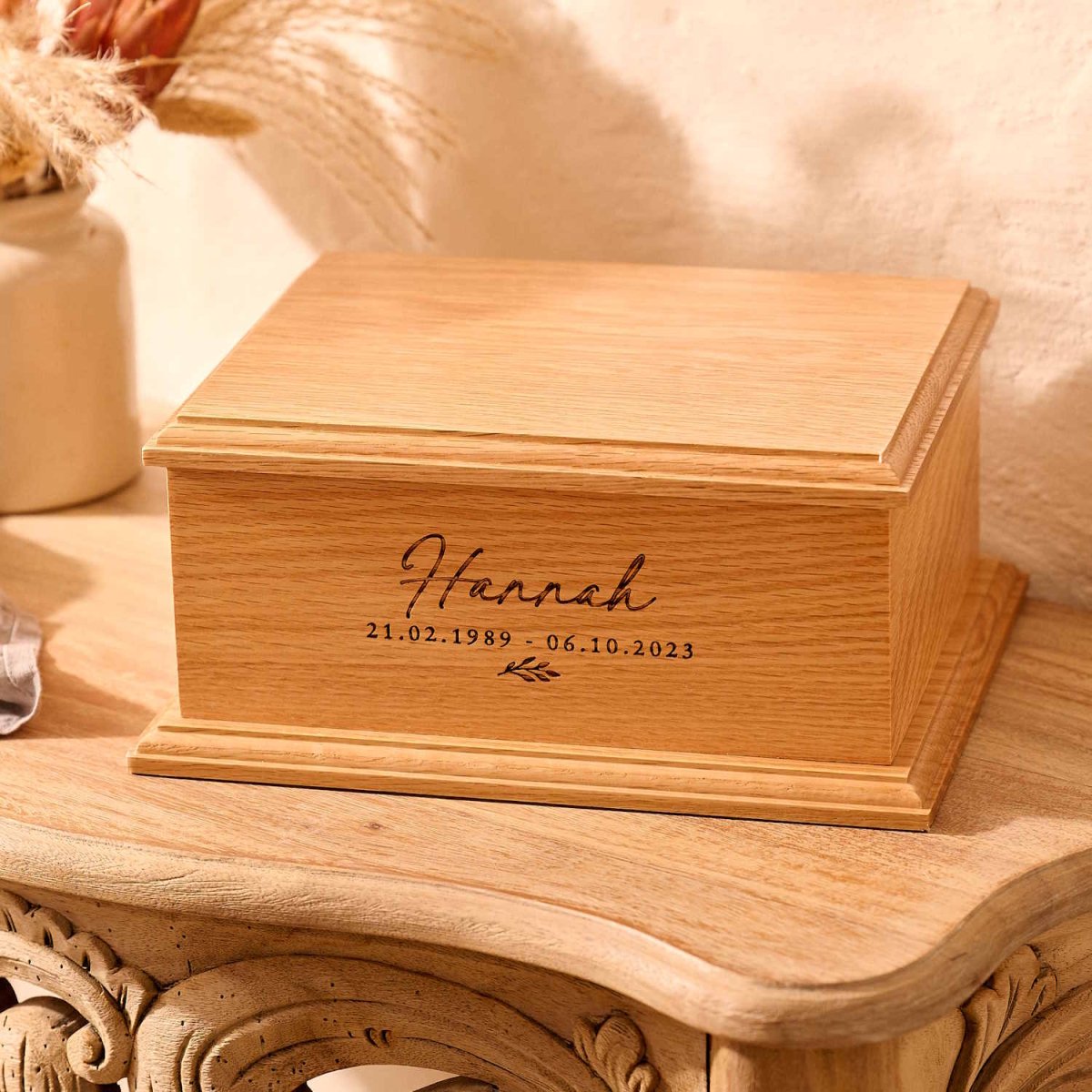 Handcrafted oak urn with custom floral design for women – wooden ashes keepsake
