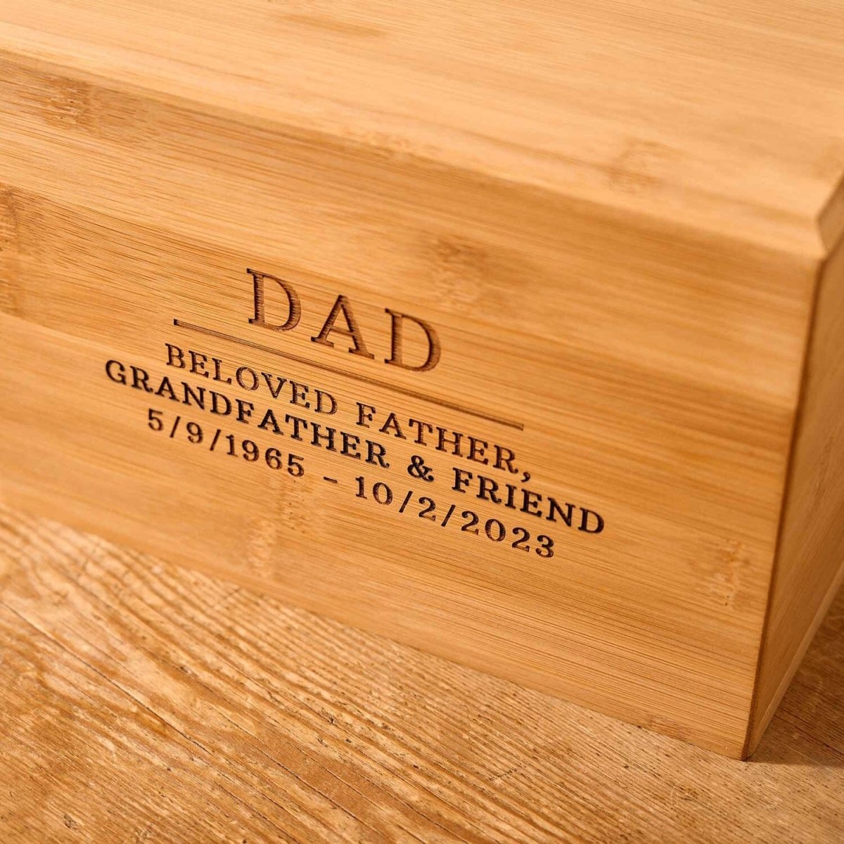 Close-up of custom engraved bamboo wood cremation urn – detailed view of solid wood memorial