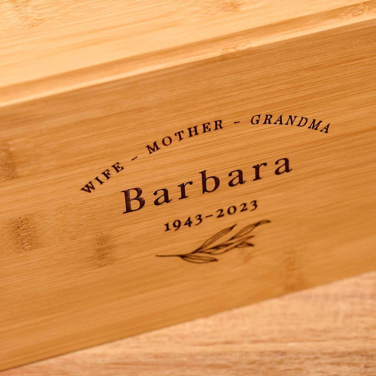 Close-up of bamboo wood cremation urn – eco-friendly engraved solid wood ashes keepsake