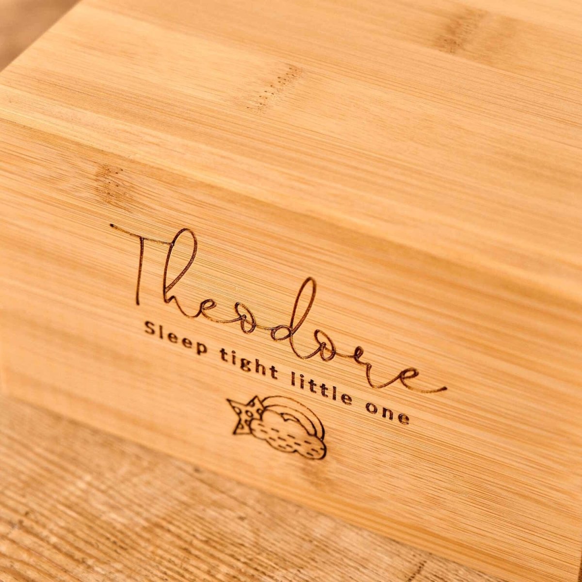 Personalised Stillborn urn for ashes with rainbow and cloud engraving, engraved with the name Theodore and “Sleep tight little one” message.