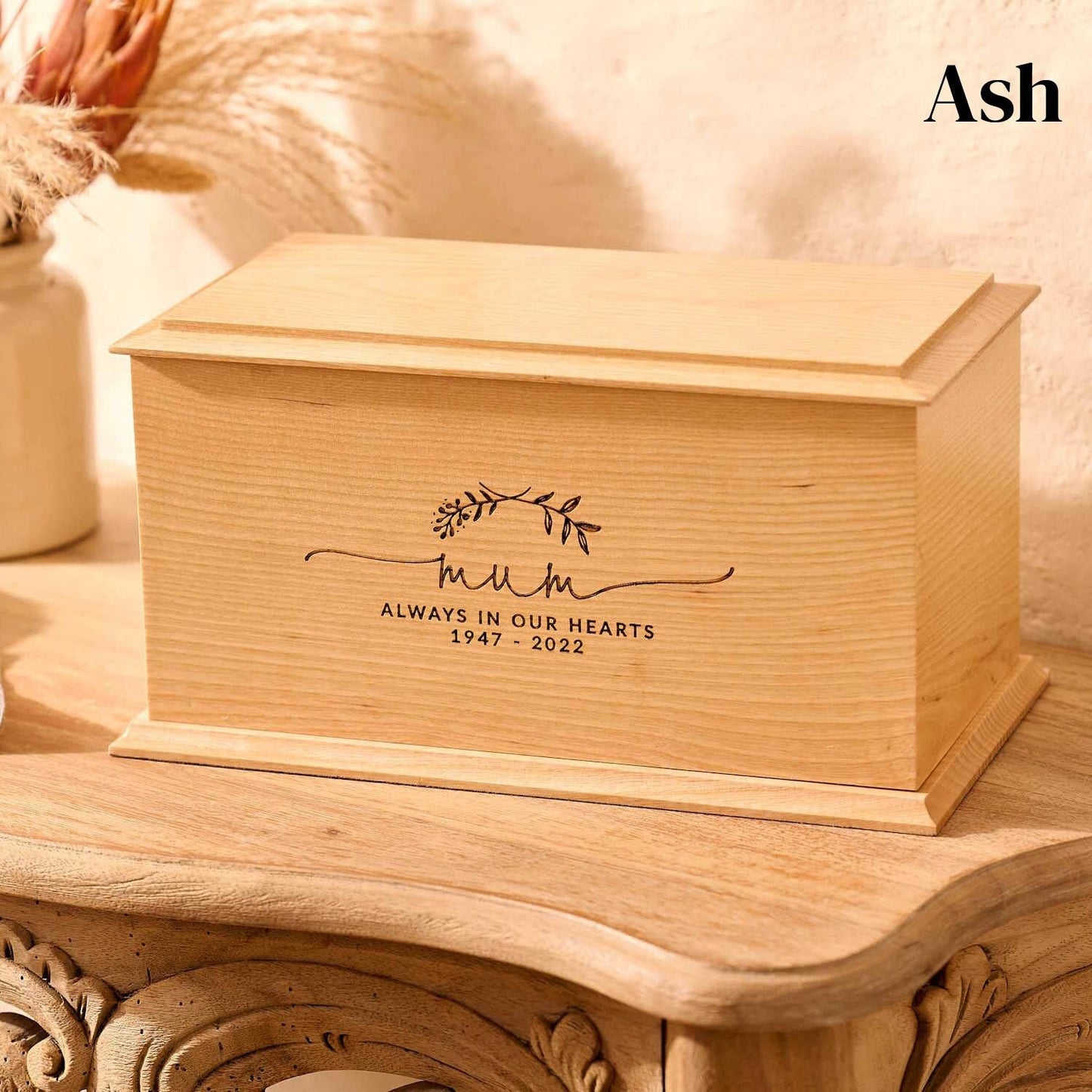 Handcrafted ash urn with custom laurel wreath design – memorial ashes keepsake