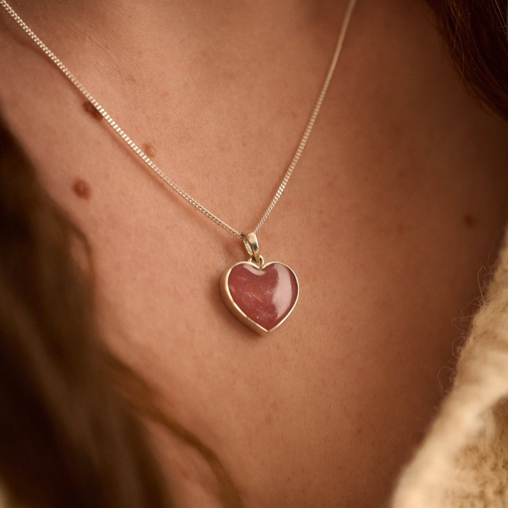 Cremation Ashes Heart Necklace with pink resin worn by female model