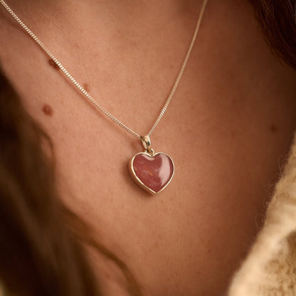 Cremation Ashes Heart Necklace with pink resin worn by female model