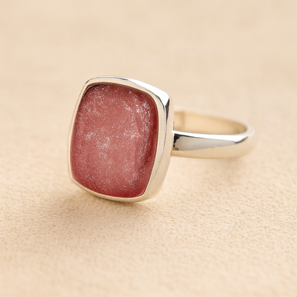 Silver Square Memorial Ashes Cremation Ring with dark pink resin, filled with ashes or fur, displayed on a soft beige background – suitable for pet or human memorials.