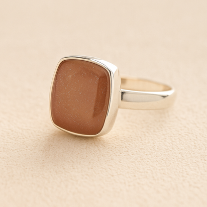 Silver Square Memorial Ashes Cremation Ring with mocha resin, filled with ashes or fur, displayed on a soft beige background – suitable for pet or human memorials.