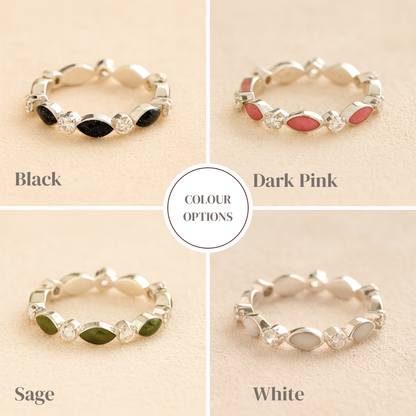 Silver cremation ashes ring with colour examples of resin and crystal accents, filled with ashes or fur, displayed on a soft beige background – suitable for pet or human memorials.