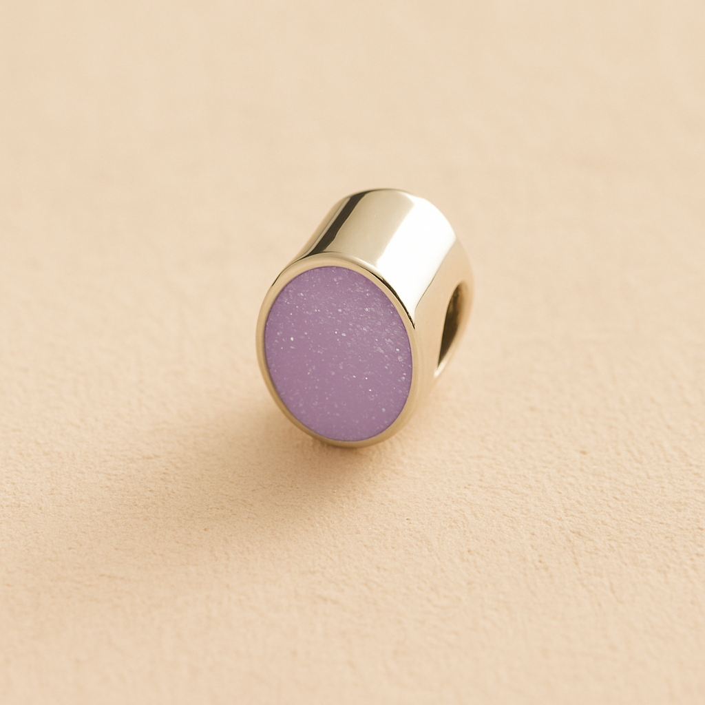 Silver Oval memorial ashes bead with a lavender resin infill designed to hold cremation ashes and pet fur. Memorial keepsake for pet loss