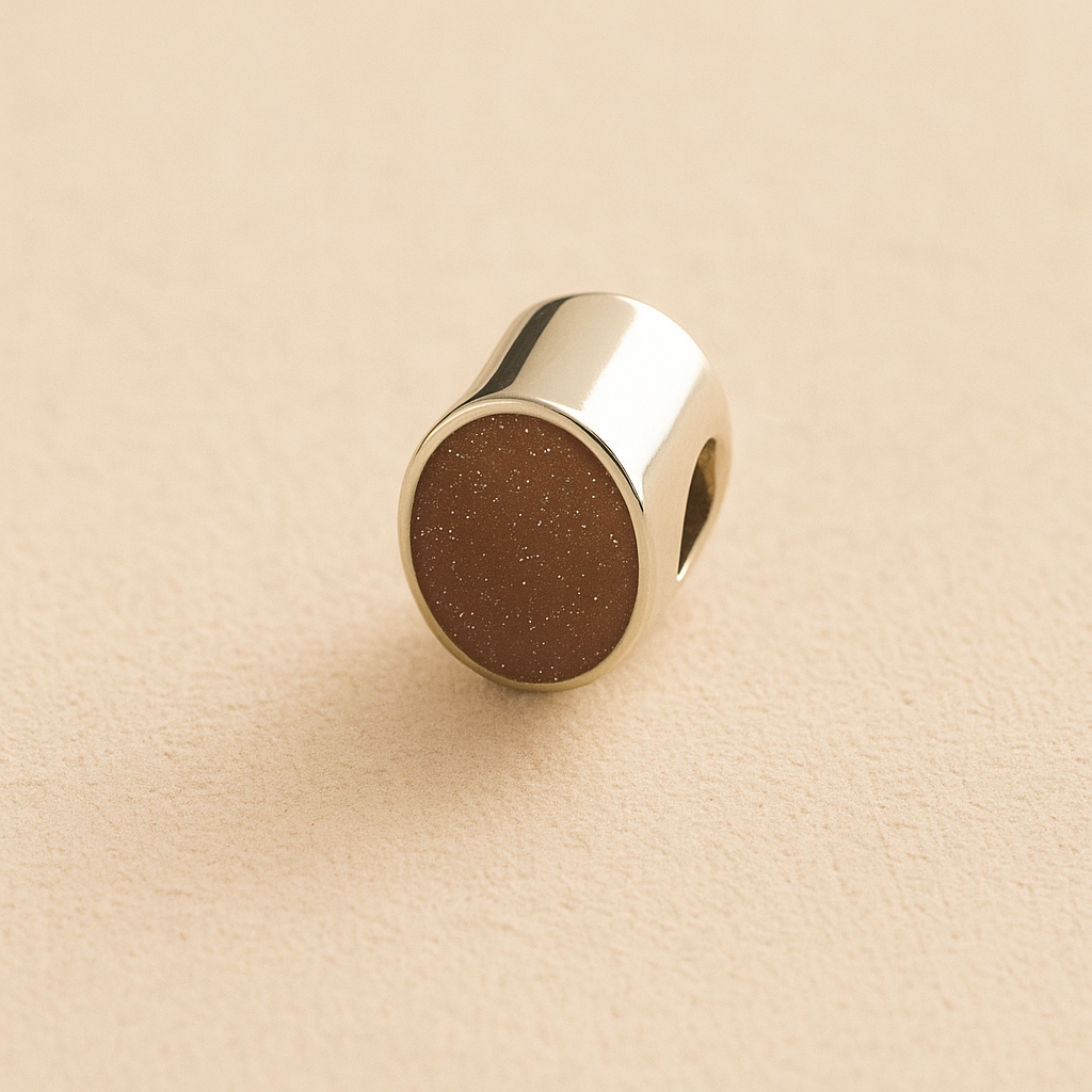 Silver Oval memorial ashes bead with a mocha resin infill designed to hold cremation ashes and pet fur. Memorial keepsake for pet loss