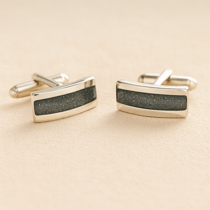 Silver Curved Memorial cufflinks with grey resin inlay with cremation ashes or fur on a beige background