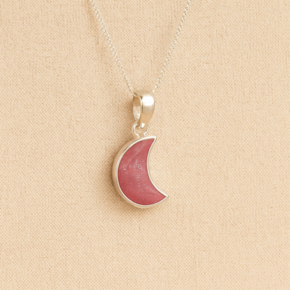 Silver Moon memorial Necklace with dark pink resin, filled with ashes or fur, displayed on a soft beige background – suitable for pet or human memorials.