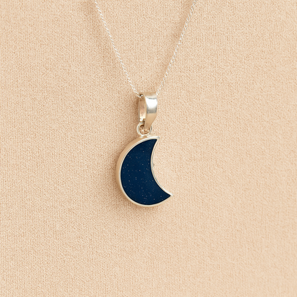 Silver Moon memorial Necklace with navy resin, filled with ashes or fur, displayed on a soft beige background – suitable for pet or human memorials.