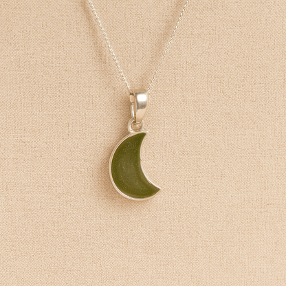 Silver Moon memorial Necklace with sage resin, filled with ashes or fur, displayed on a soft beige background – suitable for pet or human memorials.