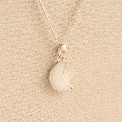 Silver Moon memorial Necklace with white resin, filled with ashes or fur, displayed on a soft beige background – suitable for pet or human memorials.