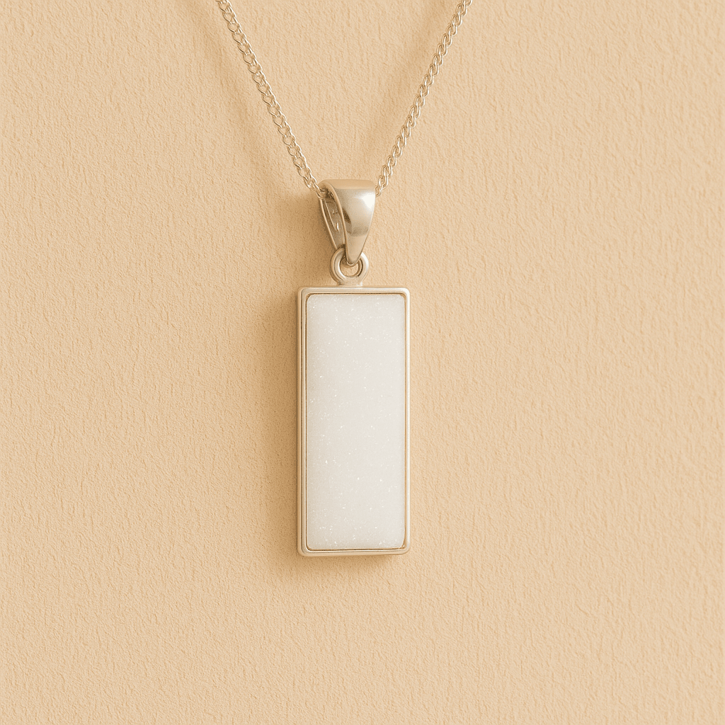 Men’s Cremation Ashes Rectangle Necklace with white resin on a beige background