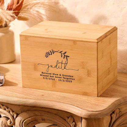 Handcrafted bamboo urn with custom laurel wreath design – sustainable ashes keepsake