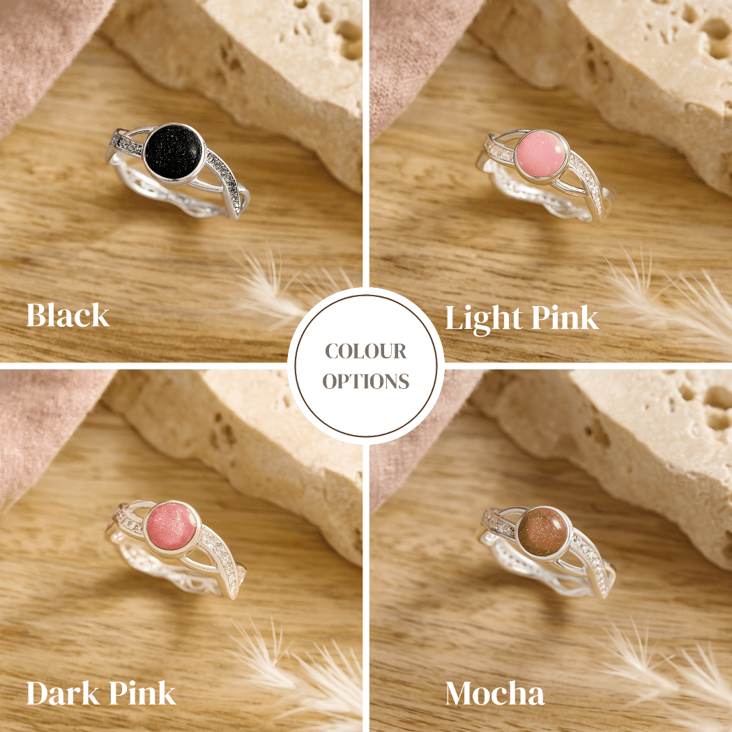 Four ash ring options in black, light pink, dark pink, and mocha colors on a wooden surface.