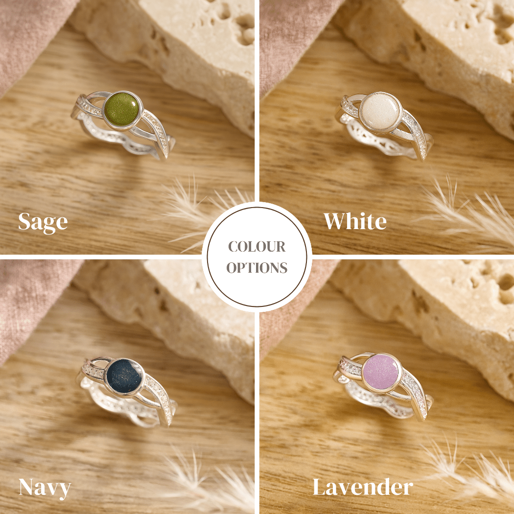 Four ashes ring options with different colored resin on a wooden surface.