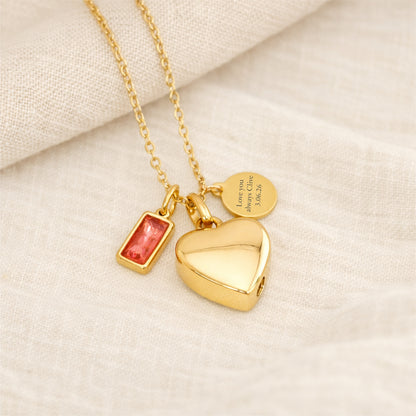 Womens self fill gold memorial necklace with heart pendant, birthstone charm and engraved tag.
