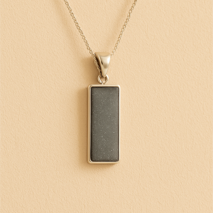 Men’s Cremation Ashes Rectangle Necklace with grey resin on a beige background