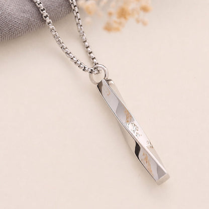 Silver twist memorial necklace on a light background