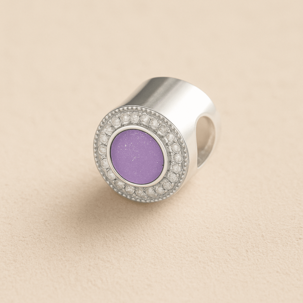 Silver Memorial Ashes Circle CZ Cremation Charm with lavender resin on a beige background