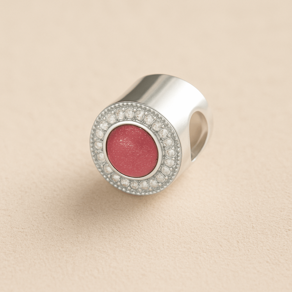 Silver Memorial Ashes Circle CZ Cremation Charm with Dark Pink resin on a beige background
