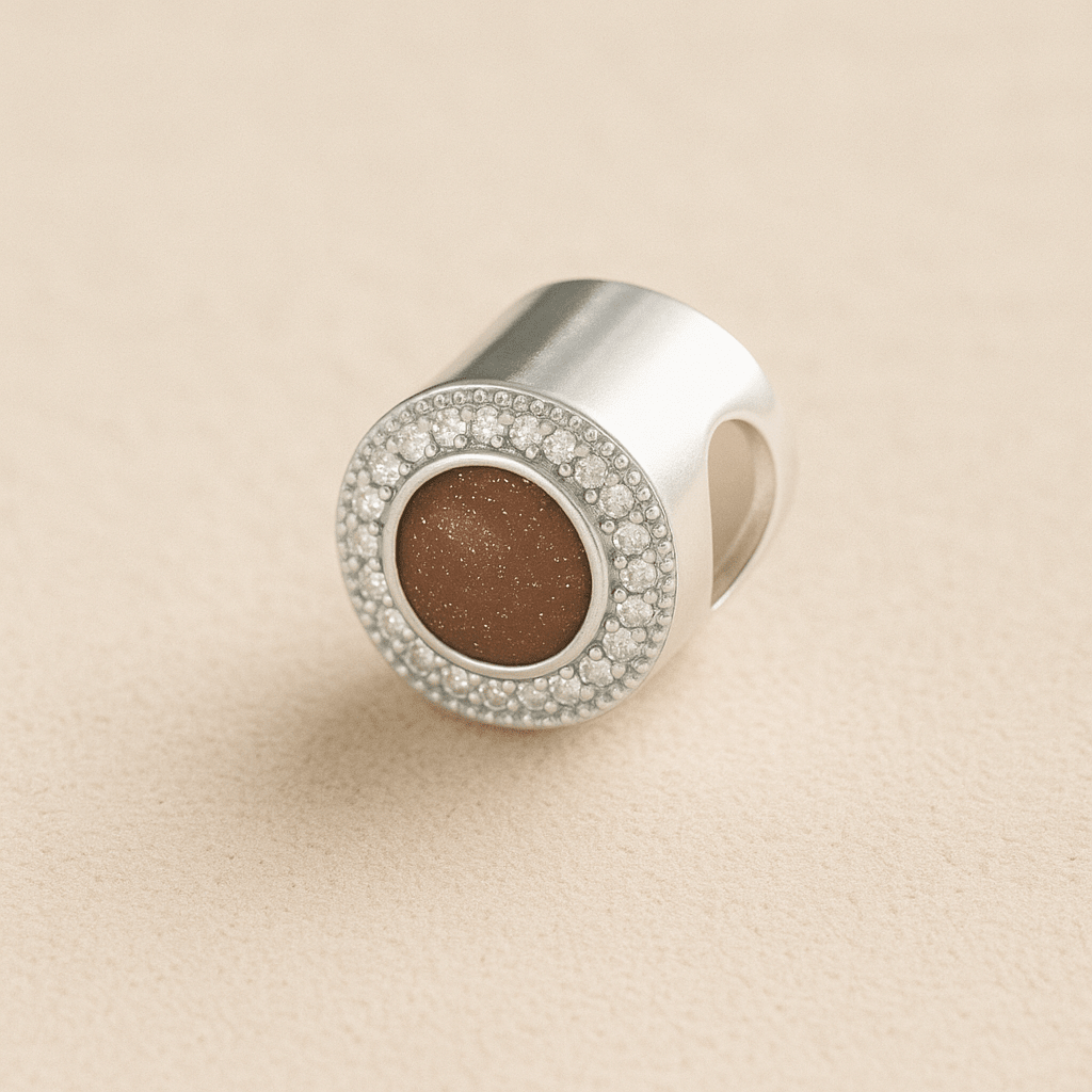 Silver Circle CZ Ashes Cremation Charm with Mocha resin on a beige background