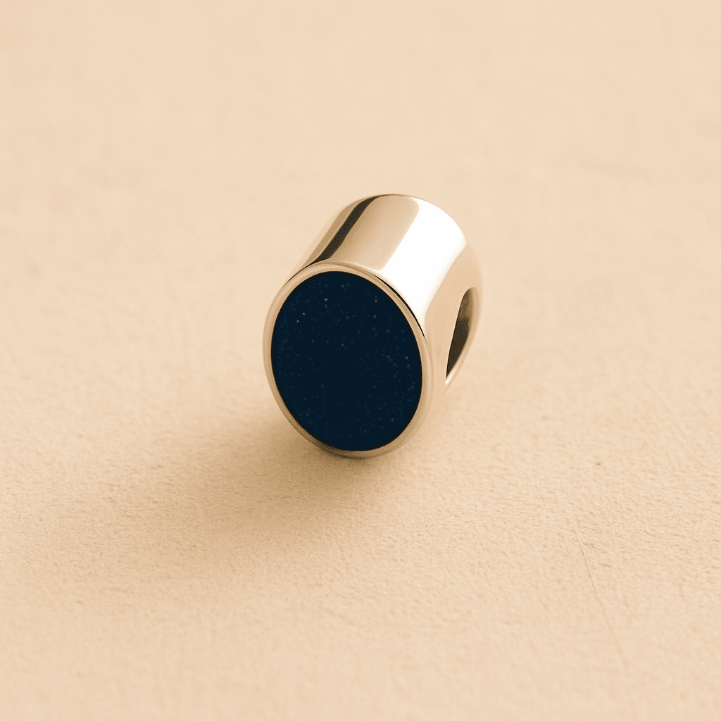 Silver Oval memorial ashes bead with a navy resin infill designed to hold cremation ashes and pet fur. Memorial keepsake for pet loss