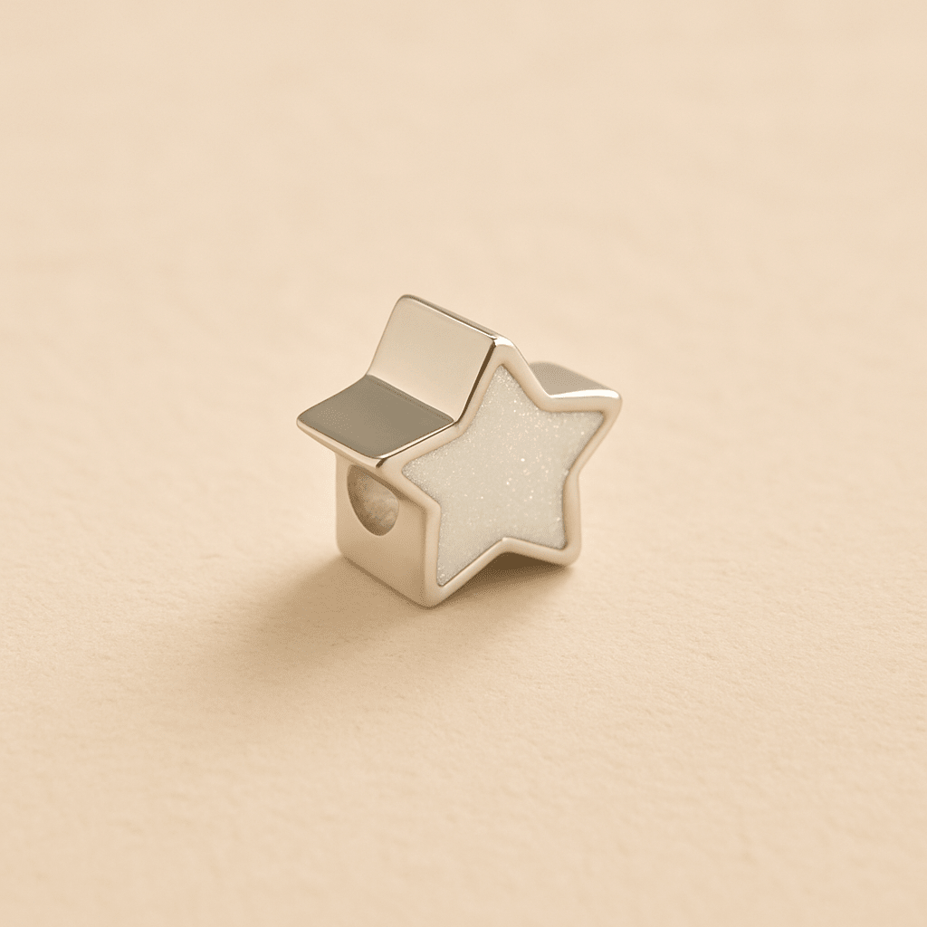 Silver Memorial Star Charm Bead with white resin on a beige background