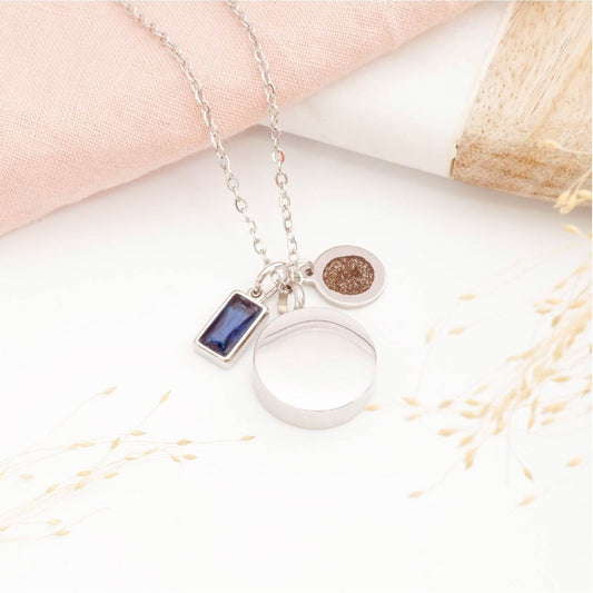 Fingerprint necklace with self fill urn pendant and birthstone charm on a light background. Memorial Jewellery for him