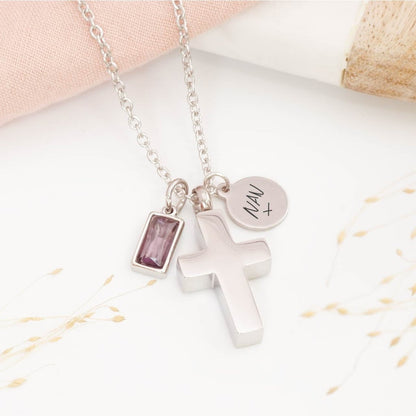 Silver handwriting necklace with cross urn, birthstone charm on a light background