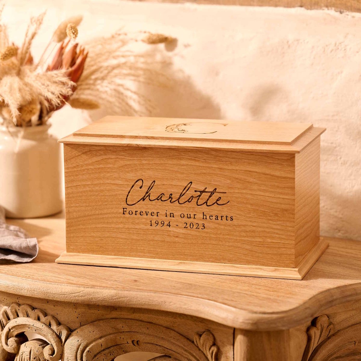 Personalised ash wood cremation urn with floral engraving – custom engraved wooden urn for ashes