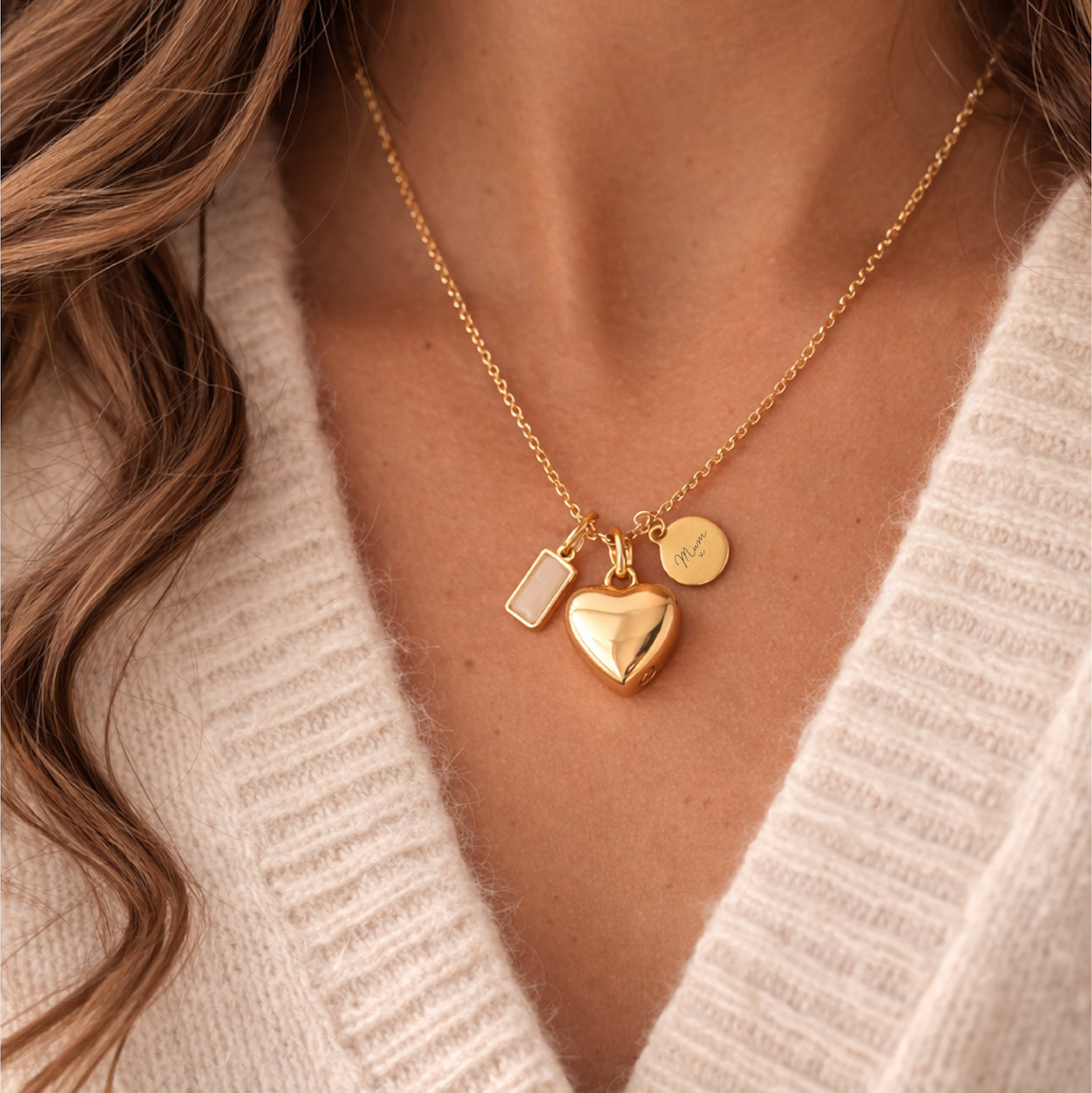 Gold self fill heart urn ashes necklace worn on a model with engraved tag and birthstone charm