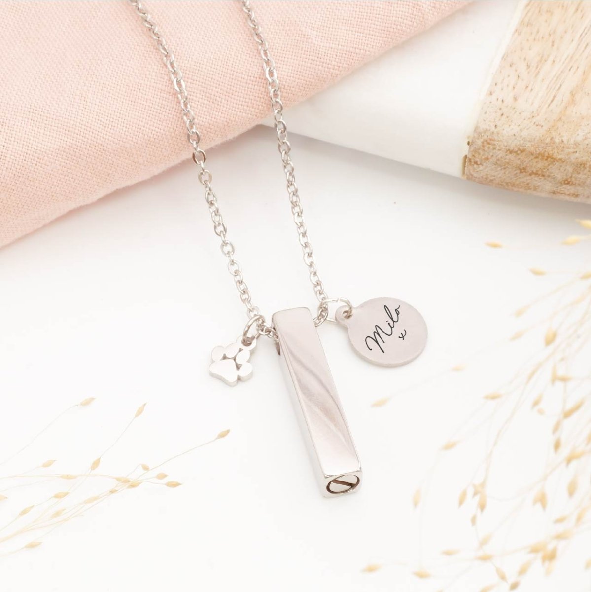 Personalised minimalist pet ashes necklace – sleek memorial jewellery for pet loss, includes engraved tag and paw print charm