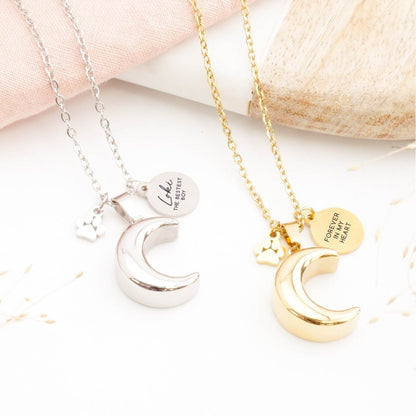 Gold and silver moon pet memorial necklace with engraved tags and paw print charms