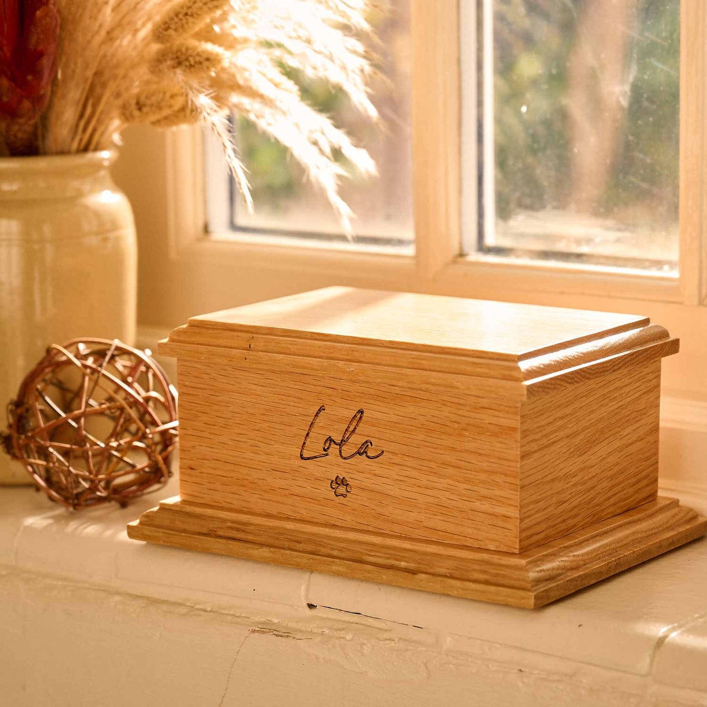 Personalised pet cremation urn in solid oak