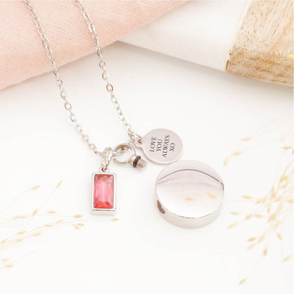 Close-up of circular cremation pendant – detailed view of memorial jewellery for stillborn loss or Mother's Day remembrance