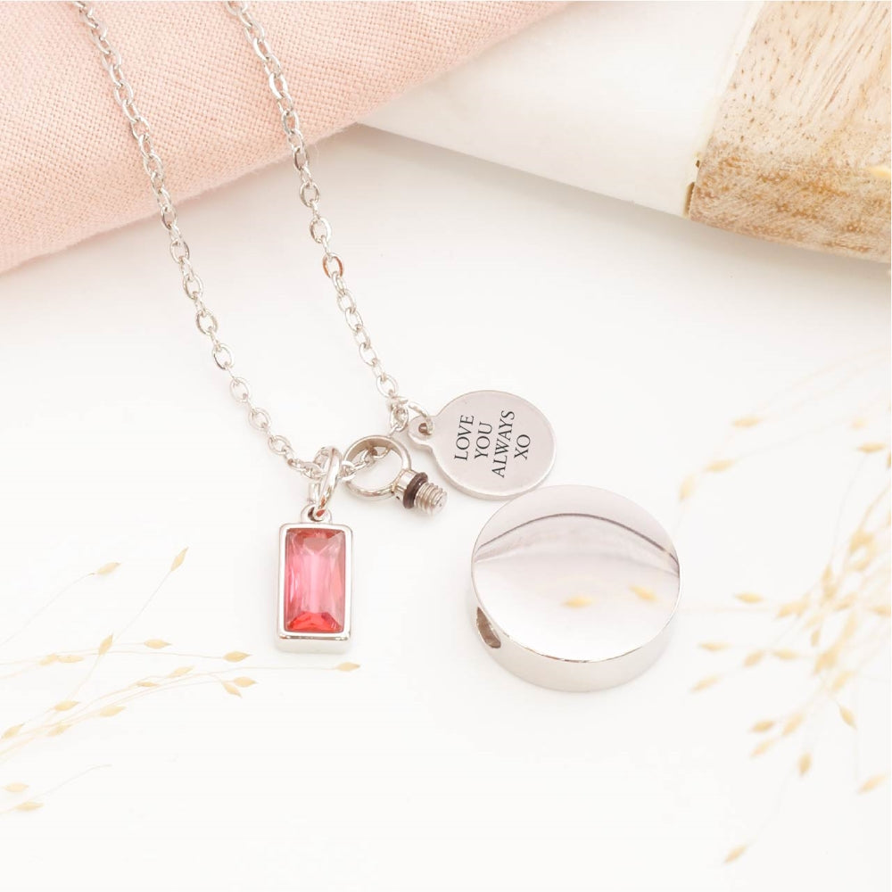Close-up of circular cremation pendant – detailed view of memorial jewellery for stillborn loss or Mother's Day remembrance