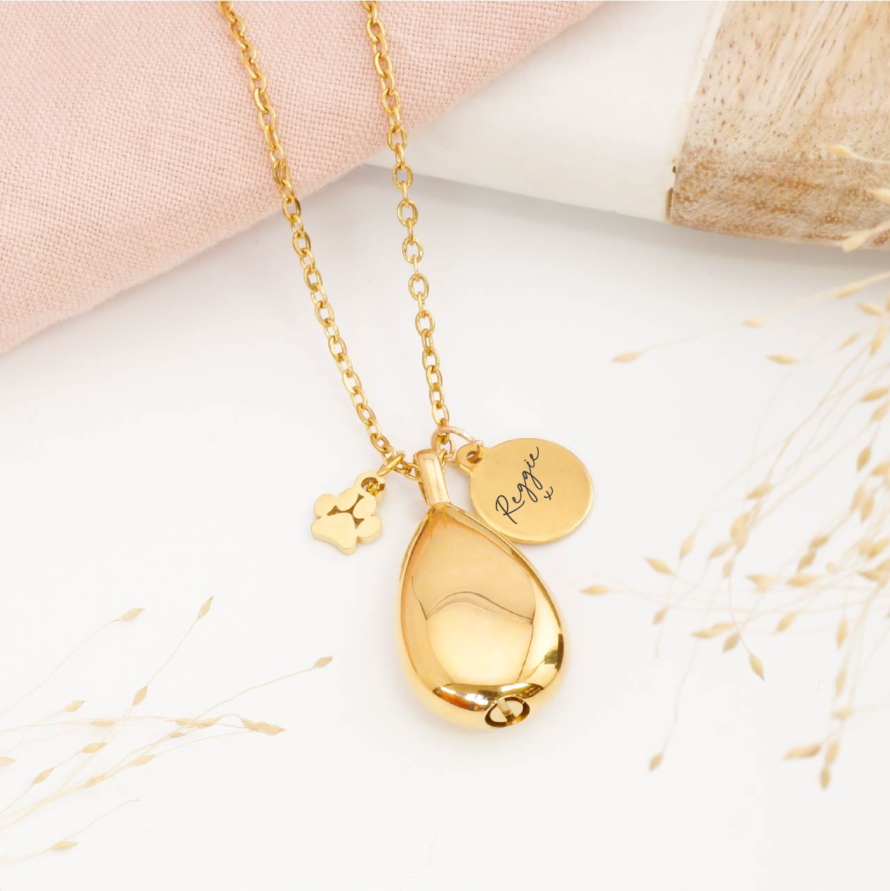 Personalised teardrop pet ashes necklace – memorial jewellery for pet loss, includes engraved tag and paw print charm