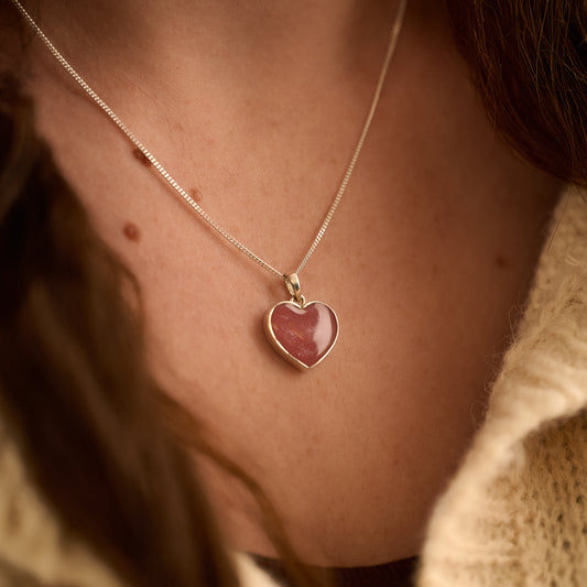 Model wearing pink memorial necklace for ashes