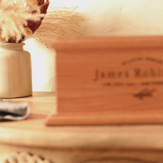 Video showing close up of a cremation urn for ashes. 
