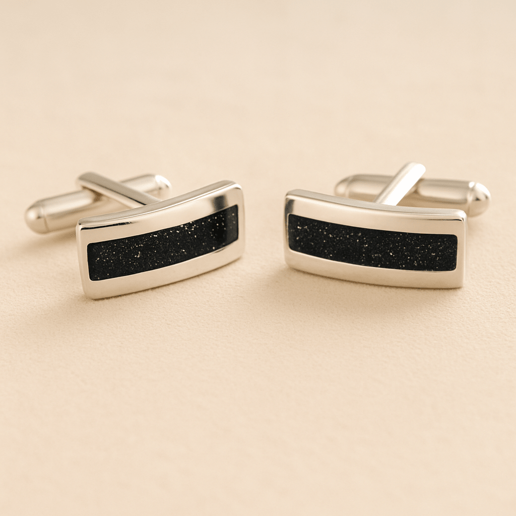 Silver Curved Ashes cufflinks with black resin inlay with cremation ashes or fur on a beige background