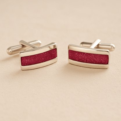 Silver Curved Ashes cufflinks with dark pink resin inlay with cremation ashes or fur on a beige background